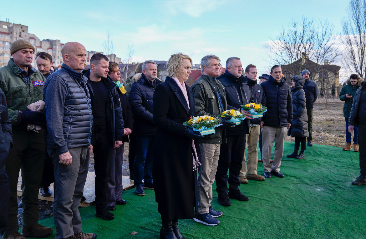 Delegation participates in a flower laying at the site of the mass grave in Bucha